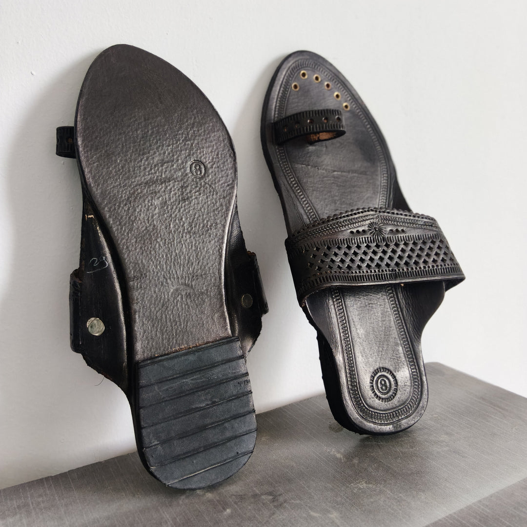 Black Angtha Patta Kolhapuri Chappal handmade from genuine leather with traditional Maharashtrian craftsmanship, premium ethnic footwear for men and women featuring authentic Kolhapuri sandal design, artisan handcrafted leather chappal, comfortable wedding footwear, black leather Kolhapuri slippers, festive ethnic sandals, traditional Indian footwear, durable handmade chappals, stylish kurta pajama footwear, luxury handmade Kolhapuri chappal for weddings and cultural occasions.